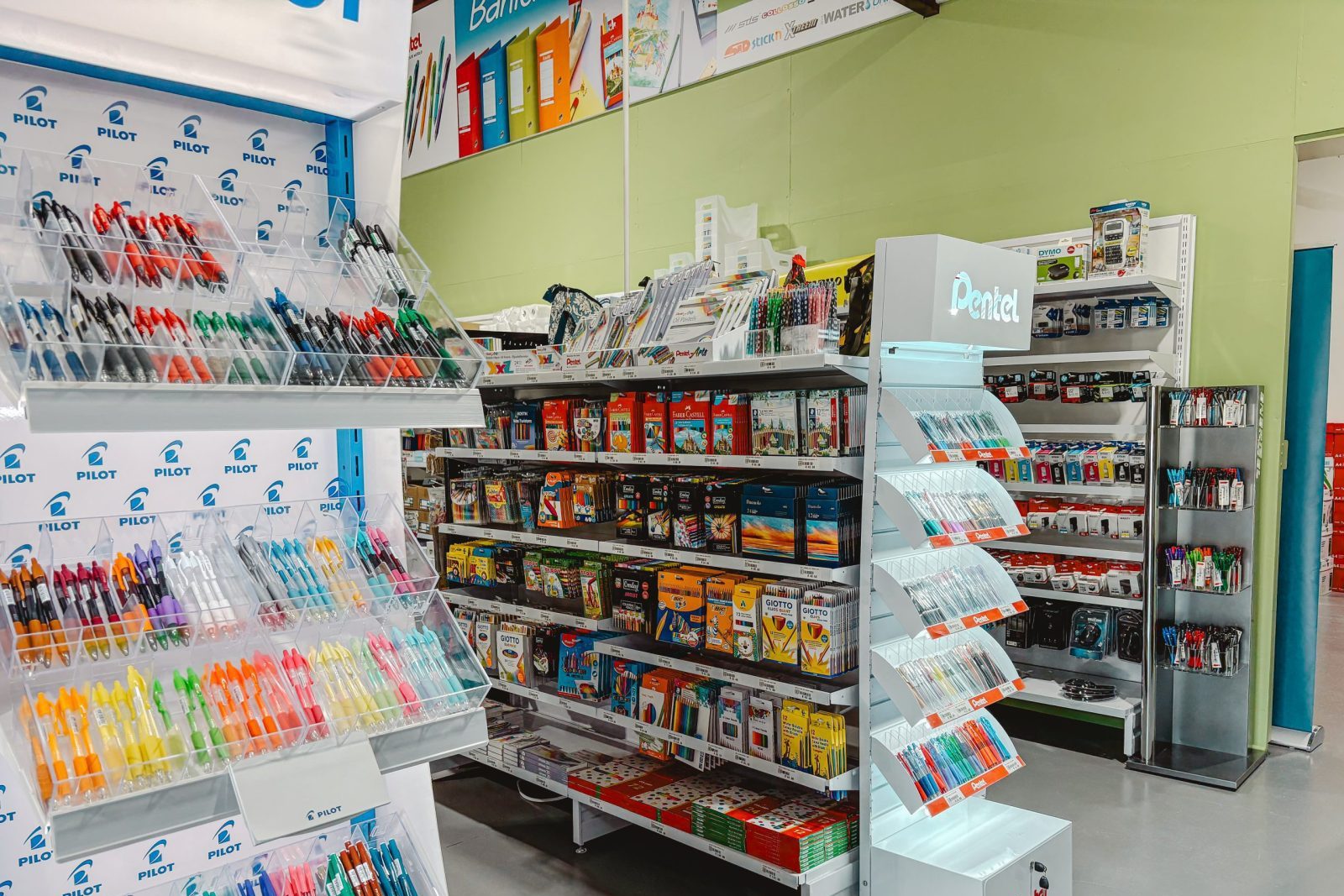Assorted stationery products displayed in a bright and organised retail environment