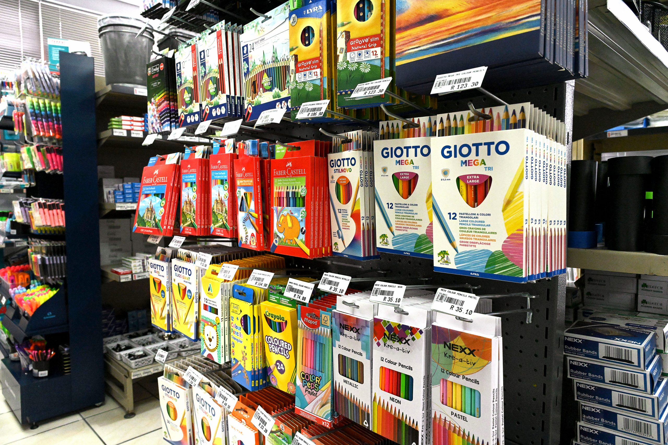 Colourful school stationery supplies including notebooks, pens, pencils and learning materials